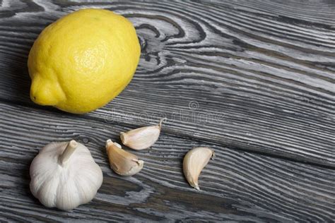 Big Yellow Lemon Head Of Garlic A Few Cloves Of Garlic Stock Photo