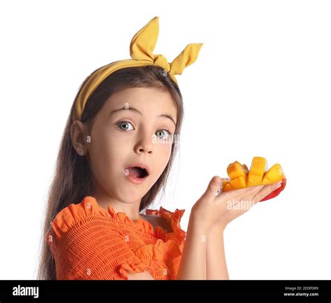 Surprised Little Girl With Fresh Mango On White Background Stock Photo
