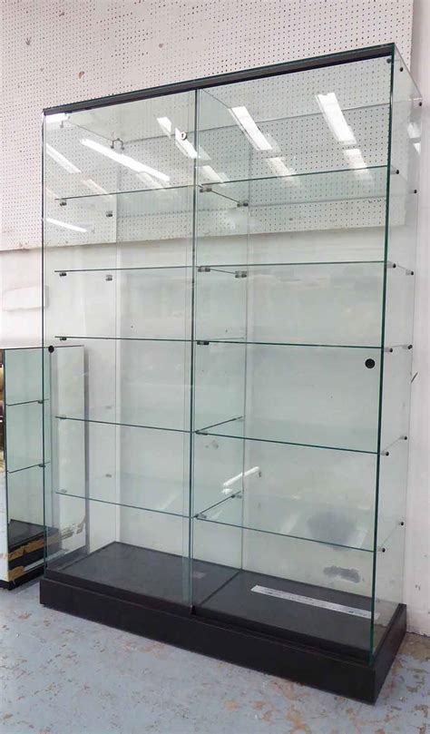 Glazed Display Cabinet Fitted Shelves Enclosed By A Pair Of Doors On