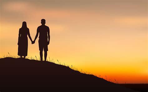 Silhouette Couple Man And Woman Holding Hand Together On Hill Under