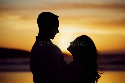 Silhouette Couple Enjoying Romantic Moment Standing Face To Face