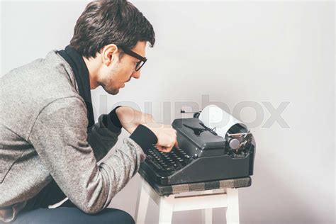 Handsome Journalist Writing With Typewriter Stock Image Colourbox