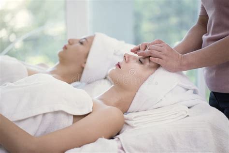 Masseur Doing Massage The Head Of Beautiful Young Woman Relaxing Stock Image Image Of Woman