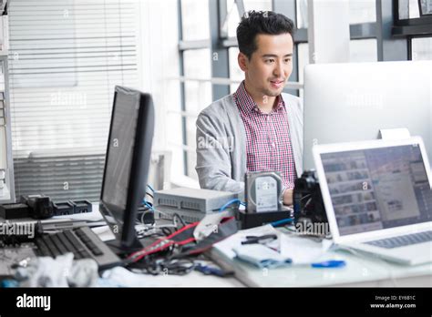 Male Photographer Working In Office With Computer Stock Photo Alamy