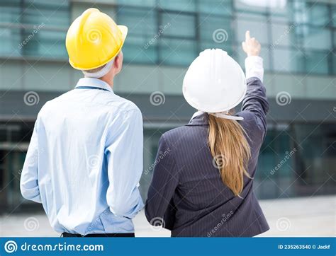 Smiling Engineer And Woman Designer Are Estimating Results Of Their