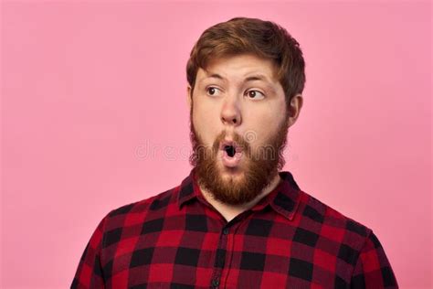 Man With Emotions On His Face With A Beard On A Pink Background Logo