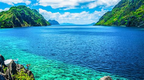 Palawan Philippines A Scenic View Of The Sea And Mountain