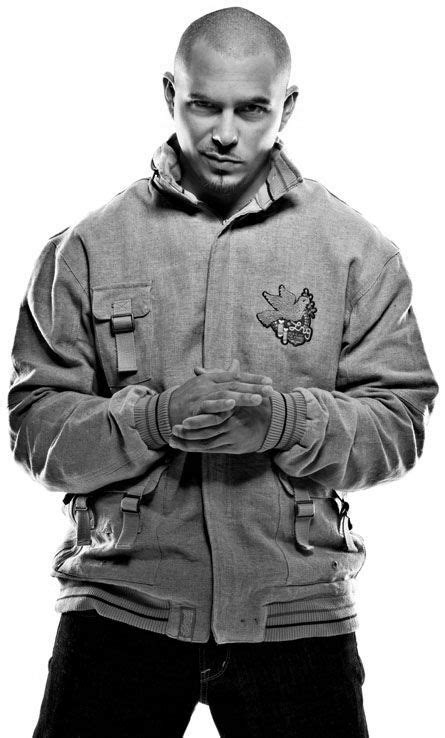 Black And White Photograph Of A Man In A Jacket With His Hands Folded