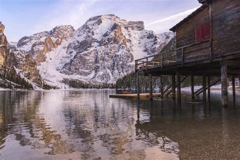 Braies Lake And Dolomite With Snow Quiet Water And Palafitte Harbor