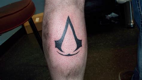 Assassins Creed Tattoo On Forearm By Beanie