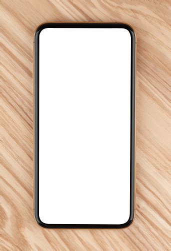 Smartphone With A Blank White Screen New Popular Smartphone On A Wooden
