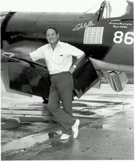 A Man Standing In Front Of An Airplane