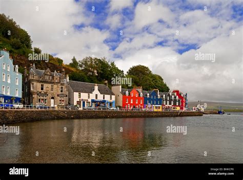 View Of The Brightly Coloured Shops And Houses On The Harbour Front At