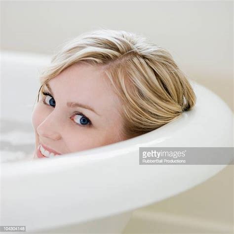 Portrait Of A Young Woman In A Bubble Bath Photos And Premium High Res