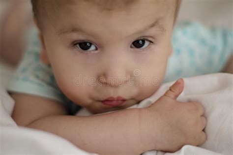 Portrait Of A Child With Cerebral Palsy Lying On His Belly Special