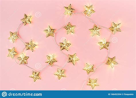 Festive Bright Background With Gold Star Lights Garland On