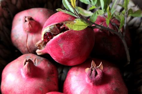 Free Photo Top View Ripe Pomegranates With A Branch From A Tree