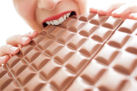 Woman Eating Chocolate Photograph By Ian Hooton Science Photo Library Pixels