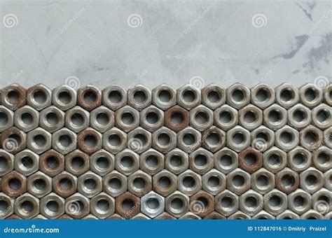 Background Of Metal Nuts And Concrete Wall Stock Photo Image Of