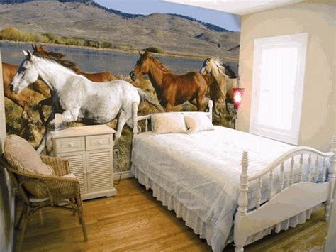 A Bedroom With Horses Painted On The Wall
