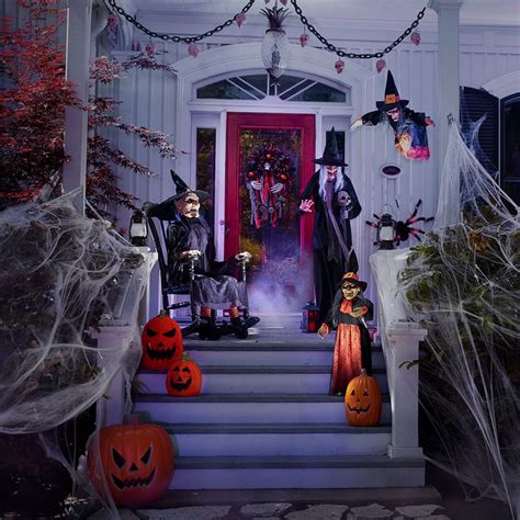 Halloween Decorations On The Front Steps Of A House