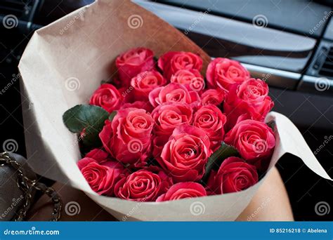 Woman Holding Perfect Bouquet Of Fresh Cut Roses In Car Stock Photo