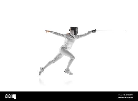 Dynamic portrait of fierce sportswoman while lightning-fast fencing