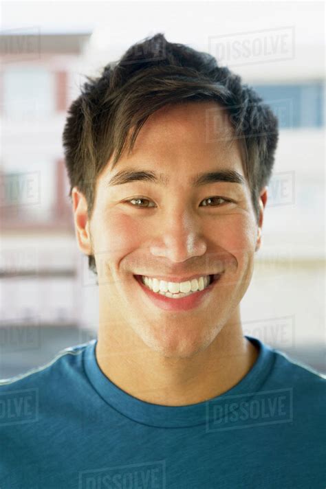 Close Up Of Asian Man Smiling Stock Photo Dissolve