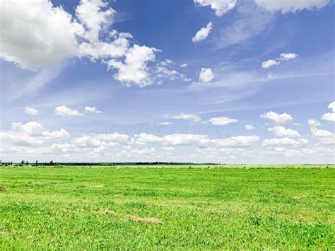 Magical Deep Aerial White Clouds On Blue Sky And Green Field Stock