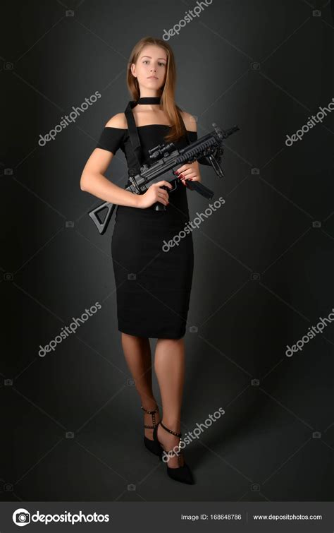 Beautiful Woman With Gun Stock Photo By ©muro 168648786
