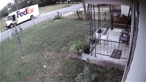 FedEx driver throwing my package (car amplifier) over an unlocked fence