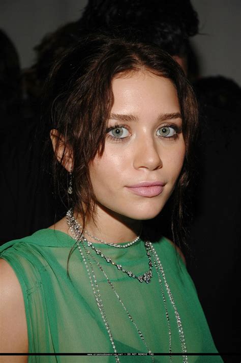 Ashley Olsen Dark Hair Green And Multiple Necklaces