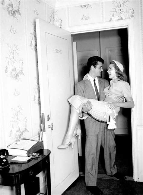 Tony Curtis Carrying His Wife Janet Leigh Over The Threshold On Their