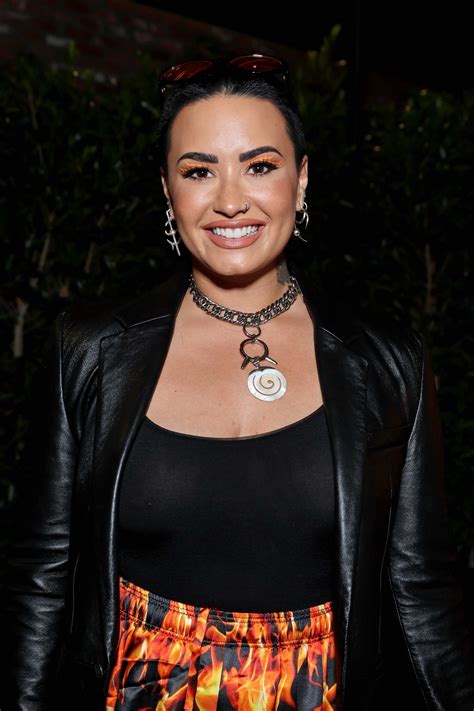 Short Haired Demi Lovato Displaying Her Ample Cleavage At A Random