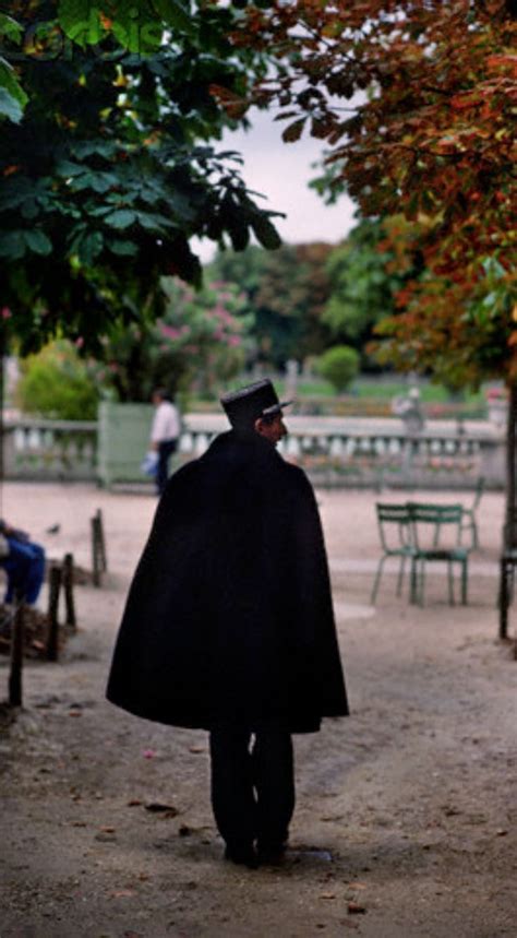 Traditional Policeman In A Cape Patrols The Luxembourg Gardens In