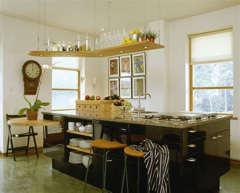 We've been using our kitchen for a couple months now, but the finishing when we were planning the kitchen, my original dream was all open shelving instead of upper cabinets. 10 Sparkling Kitchens with Open Shelving