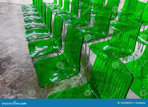 Pattern Of Neon Green Transparent Plastic Chairs Stock Image Image Of