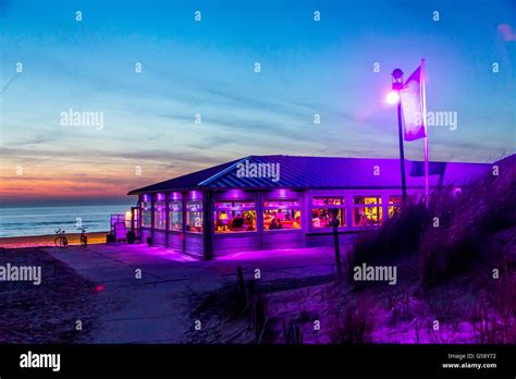 north sea seaside town noordwijk the netherlands beach bars restaurant at night dusk stock