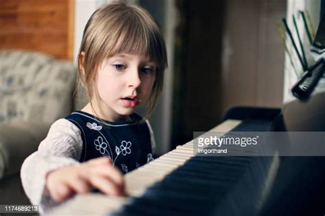 Girl Singing And Playing Piano Photos And Premium High Res Pictures