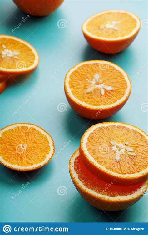 Round Slices Of Juicy Orange On A Blue Background Top