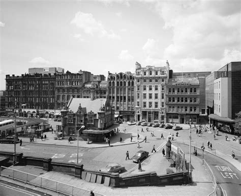 An Old Black And White Photo Of A City Square
