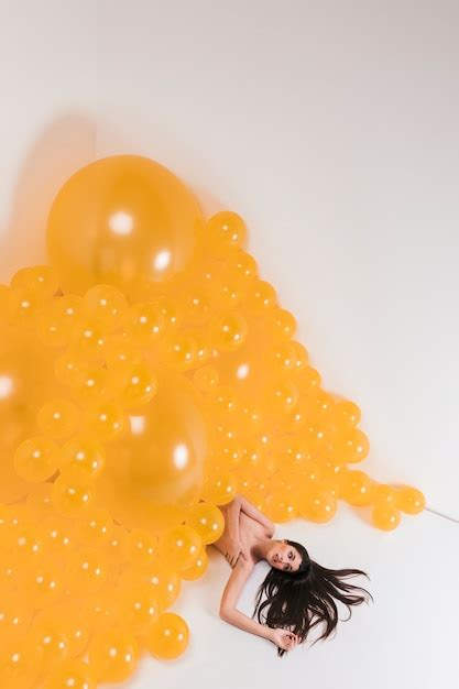 Free Photo Nude Woman Between Many Yellow Balloons
