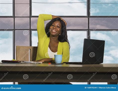 happy and attractive black african american business woman smiling confident working at office