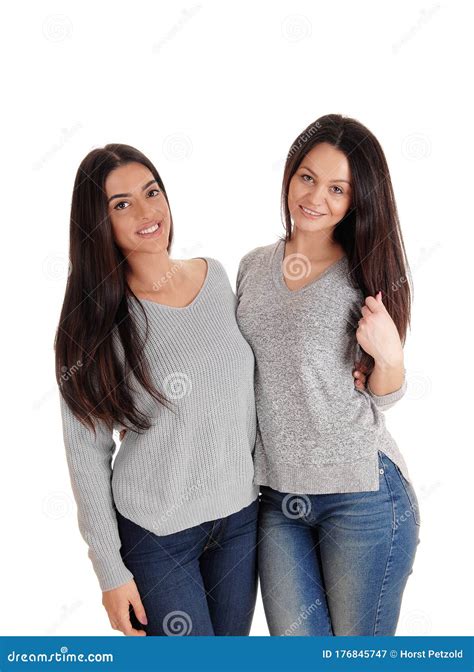 Two Lovely Woman Standing Together Looking At The Camera Stock Image