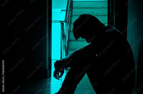 Silhouette Of Man Sitting Alonesad And Serious Man Sitting Hug His