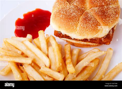 Fish Burger And French Fries On Plate Stock Photo Alamy