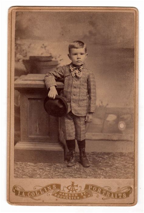 Victorian Era Photograph Of Little Boy In Suit And Tie Holding Hat