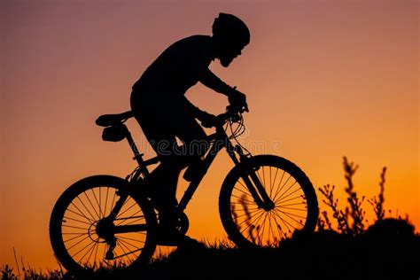 The Young Man Riding A Bike At Sunset Stock Image Image Of Healthy