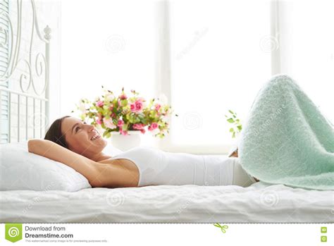 Beautiful Romantic Young Woman Covers With Blanket In Bedroom Stock