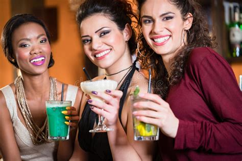 Girls Enjoying Nightlife In A Club Drinking Cocktails Stock Photo Image Of Dark European